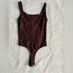 Corset like body suit.